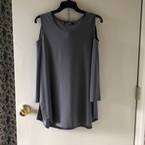 Sleeveless tunic with cut out sleeves
